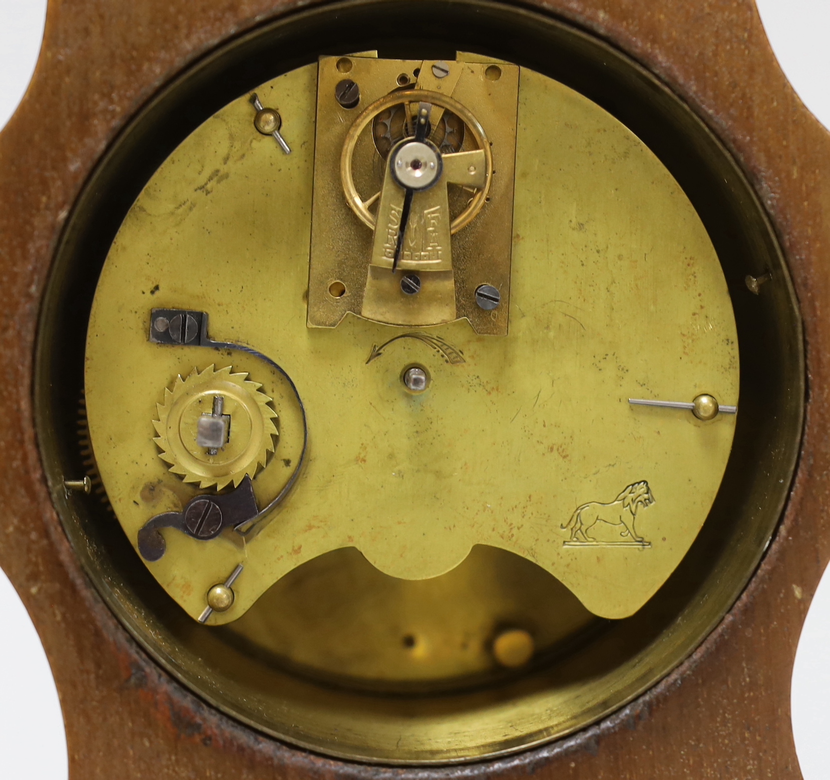 A small mahogany mantel timepiece with key, the dial inscribed B W Fase, 21cm high